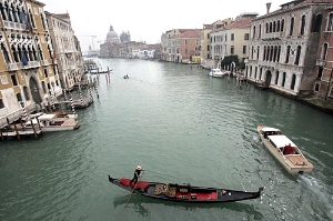 The domes of Santa Maria della Salute watch over the southern entrance to the Grand Canal.