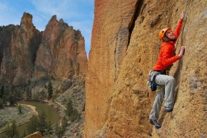 A woman rock climbing at Smith Rock State Park located outside Eugene, Oregon