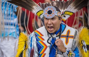 Courtney Yarhollar sings with his drum group at Red Earth Festival, Oklahoma City