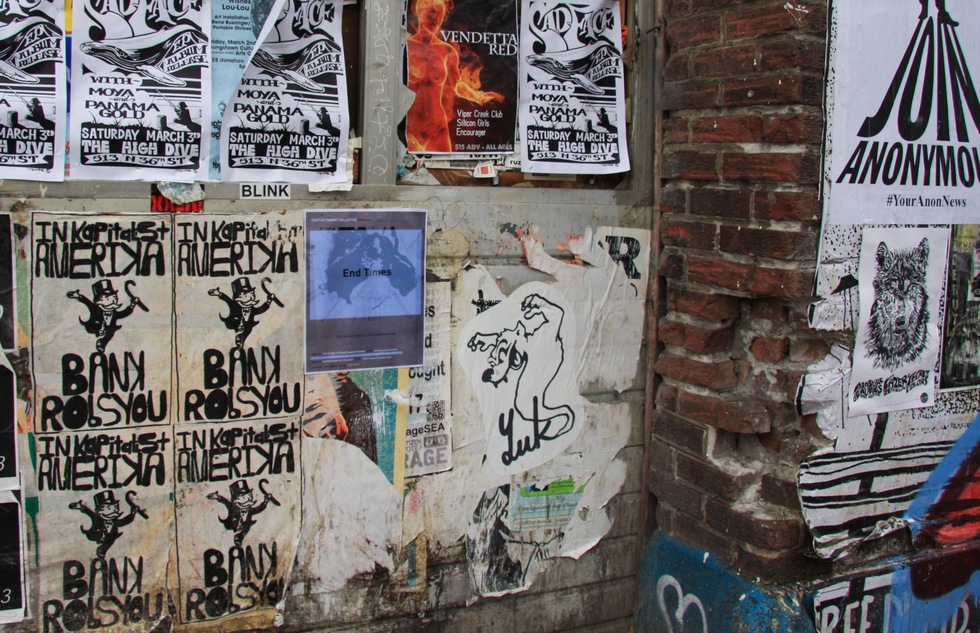 Fliers posted to a wall in Seattle's Capitol Hill neighborhood